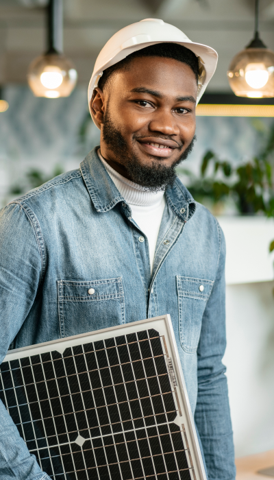 man holding a solar panel